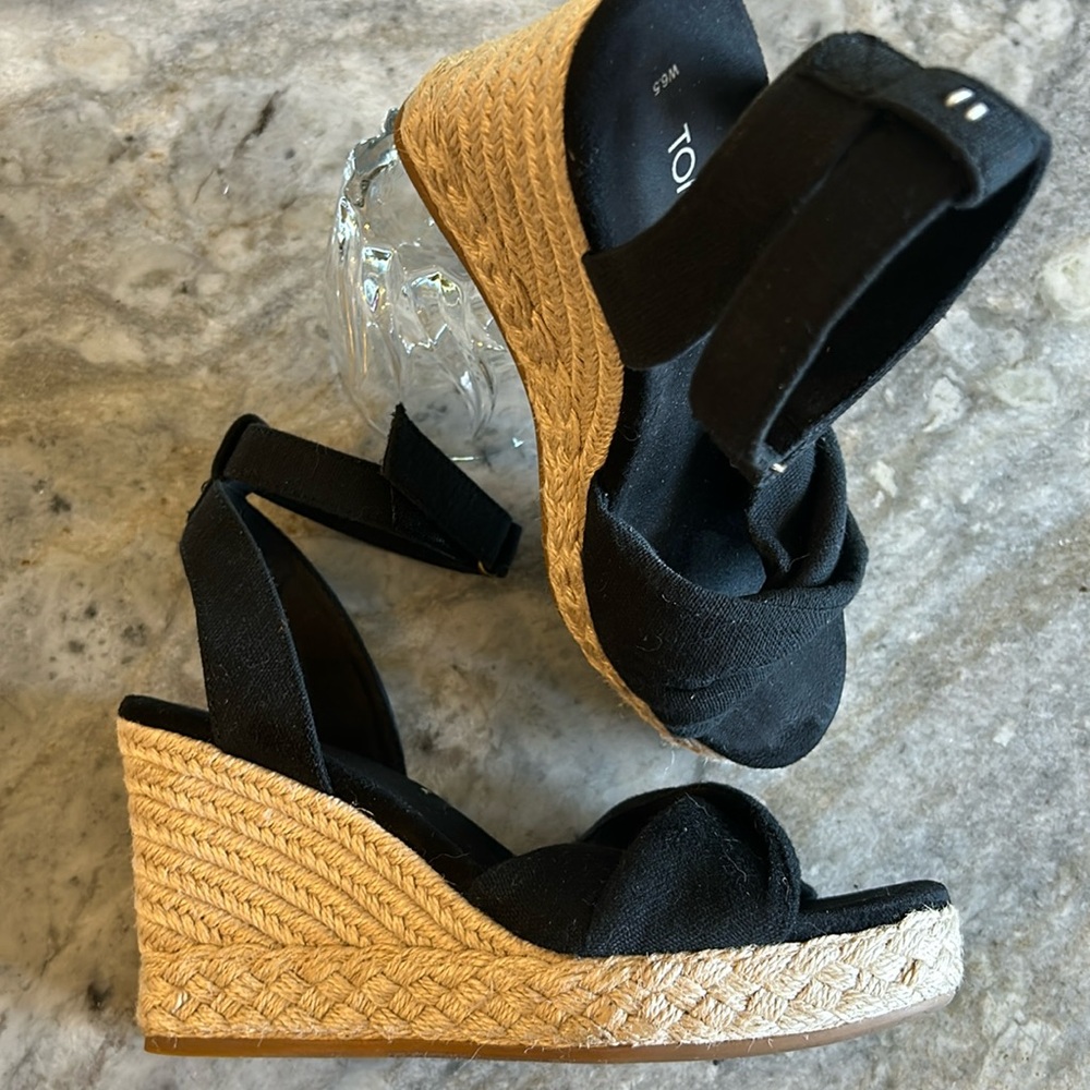 Tom’s black platform wedge with ankle straps